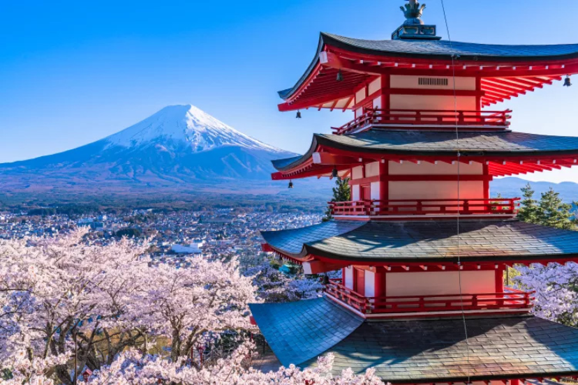 “Snow-capped Mount Fuji reflected on Lake Kawaguchiko during clear morning light”